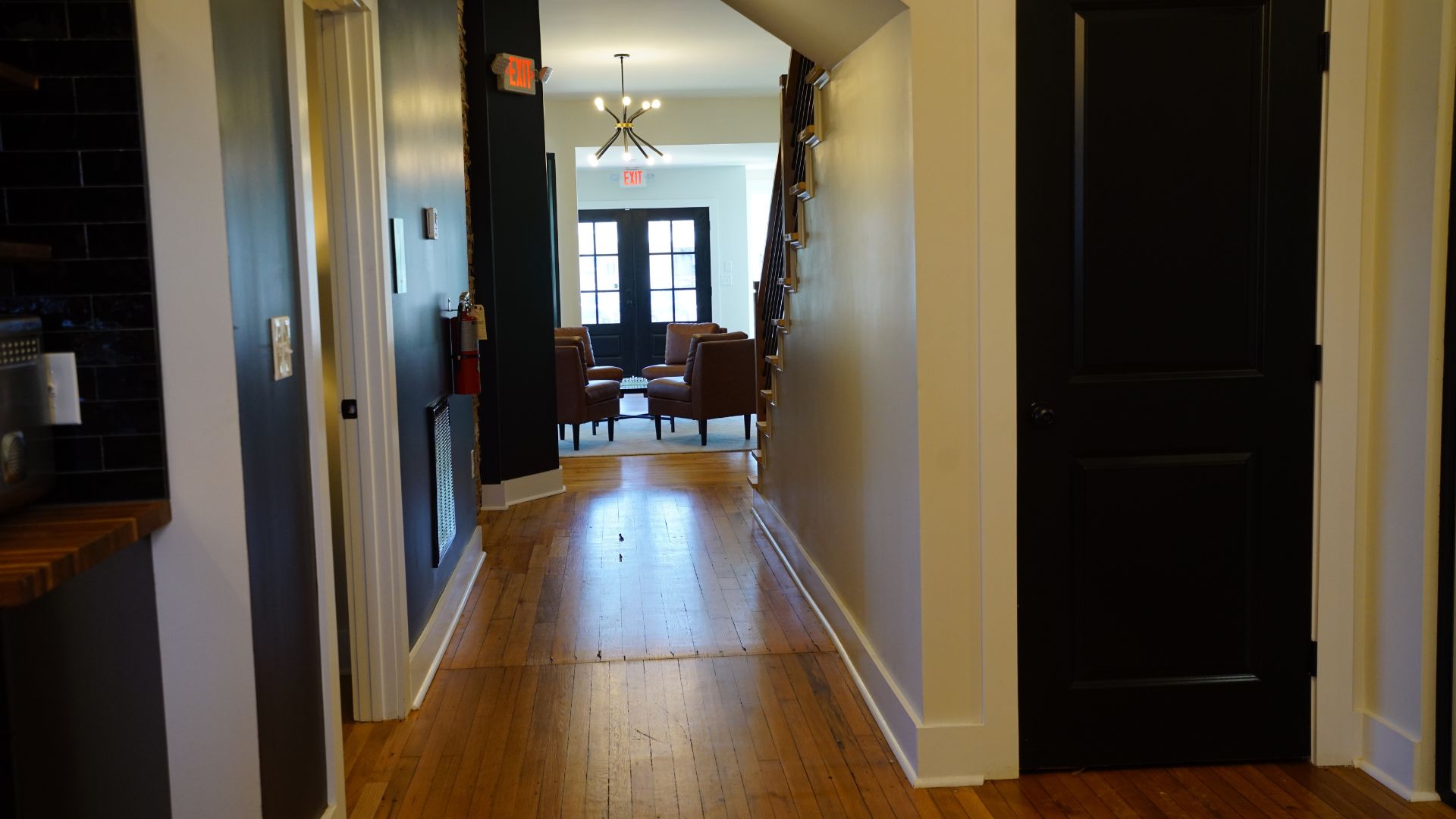Main hallway leading to lobby with leather seating at 521 N McDuffie Workspace