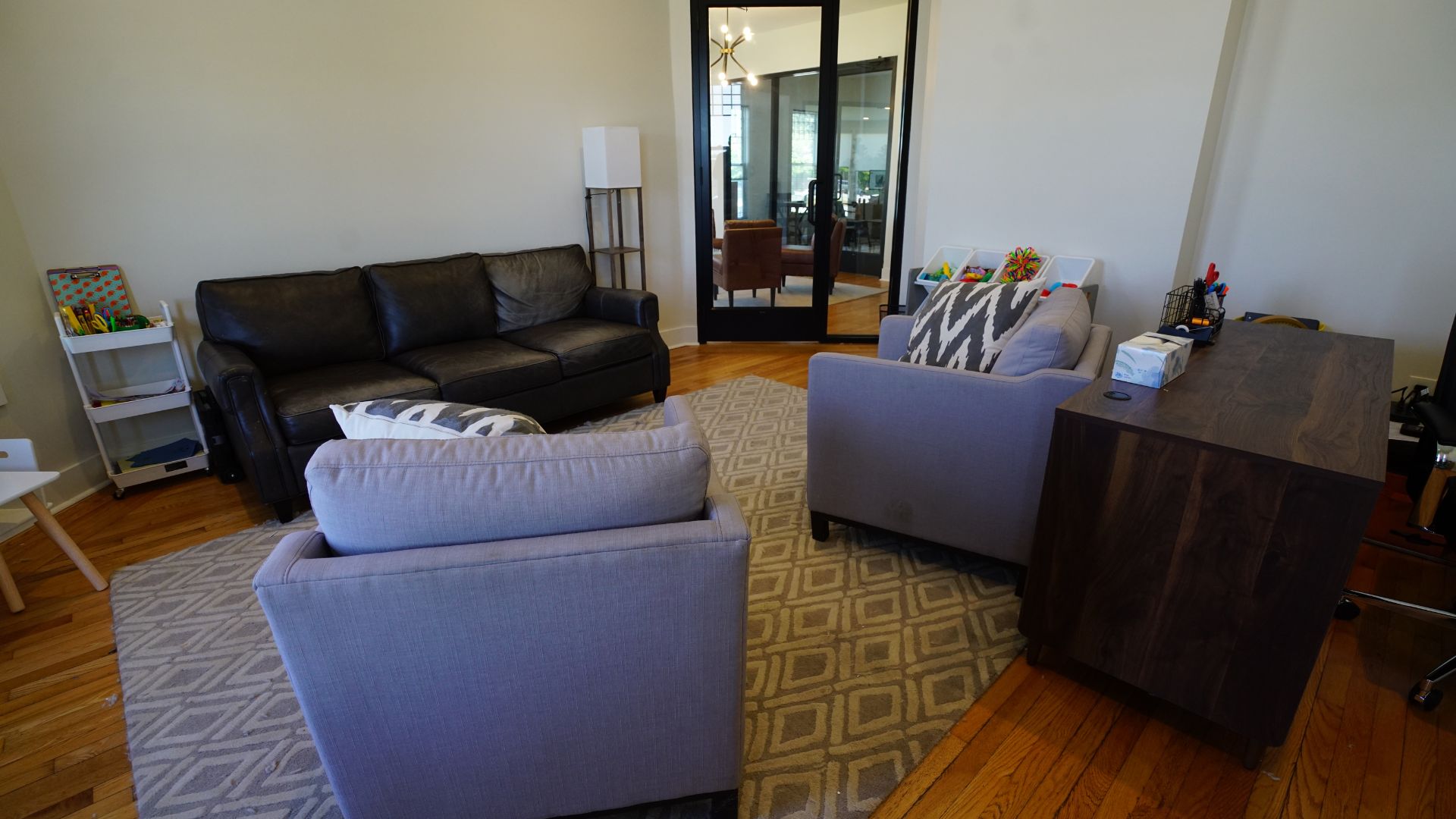 Lounge and sitting area with sofa near private offices at 521 N McDuffie Workspace